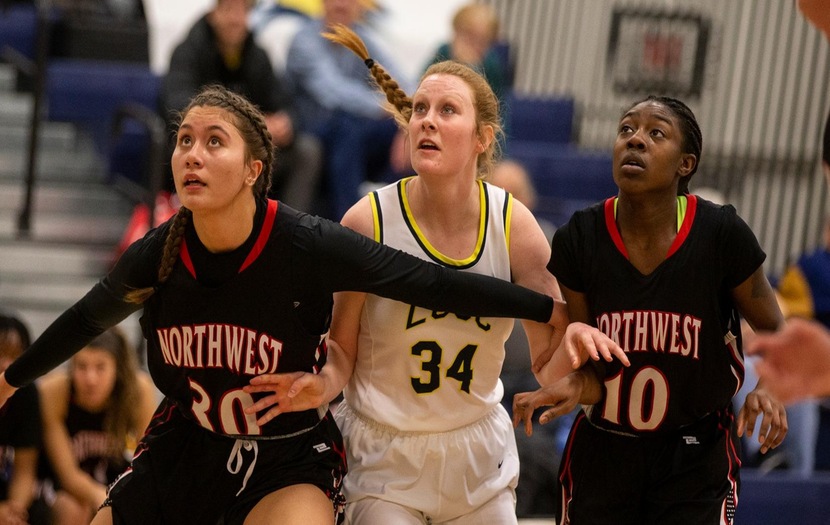 Abby Garreaud (middle) vies for rebound